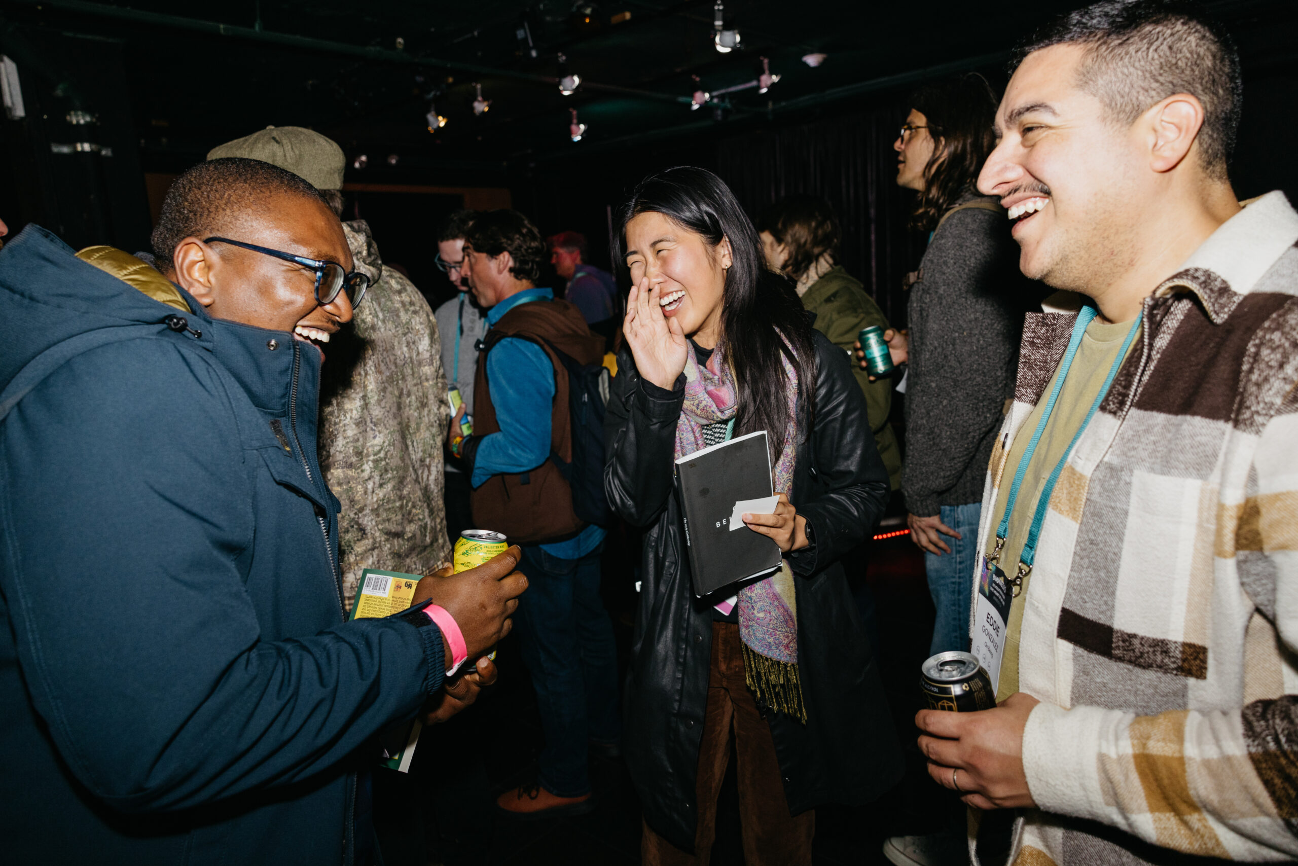 Event attendees laugh together at a party